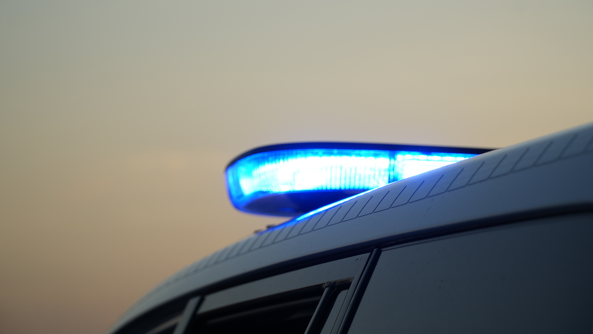 Archief_112_Politie lichtbalk zonsondergang AAN.JPG