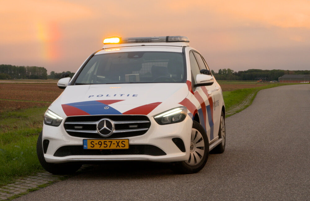 Archief_112_Politie B-klasse Zonsondergang polder