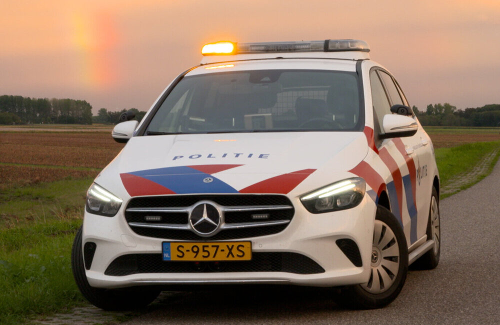 Archief_112_Politie B-klasse Zonsondergang polder